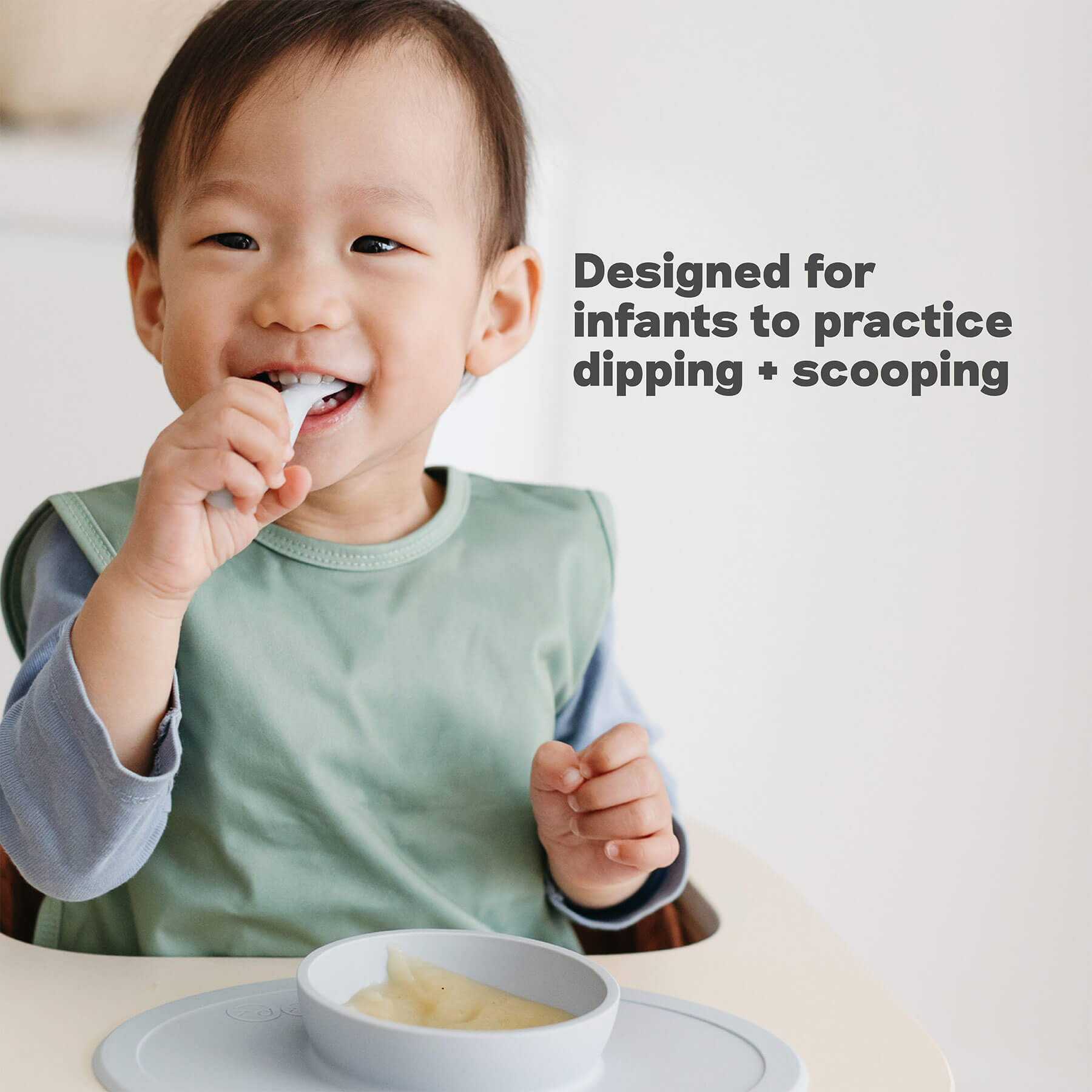 ezpz Developmental Utensil Set designed for infants to practice dipping and scooping