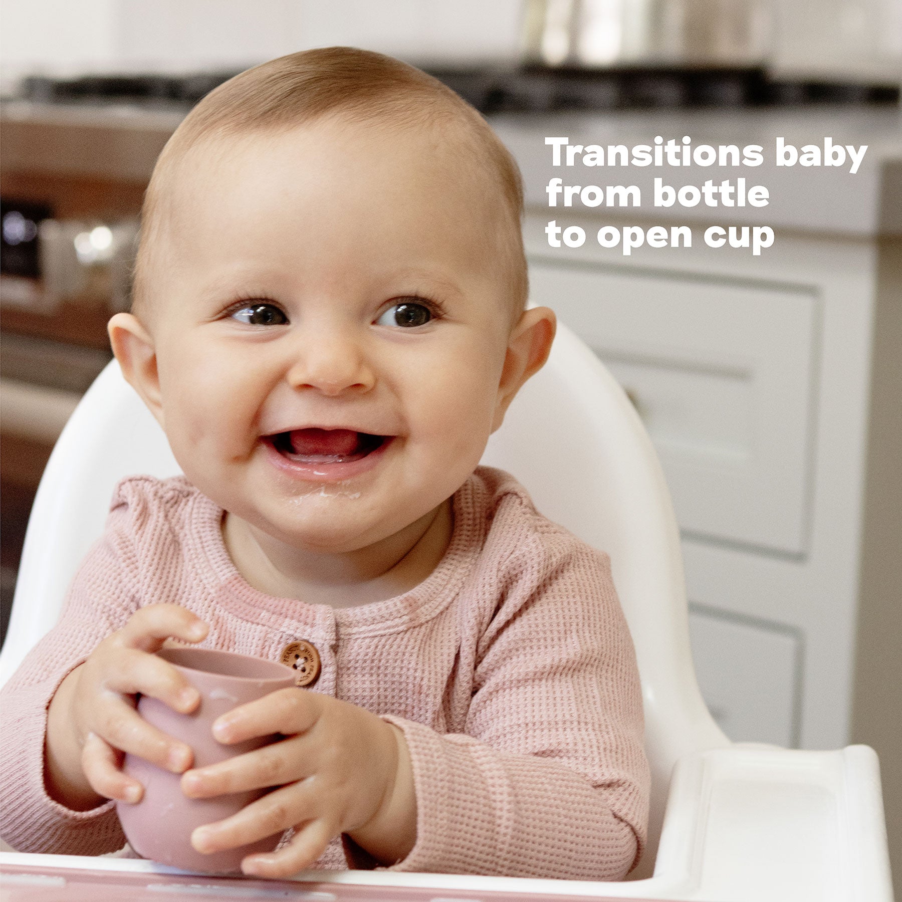 The Tiny Cup by ezpz transitions baby from bottle to open cup