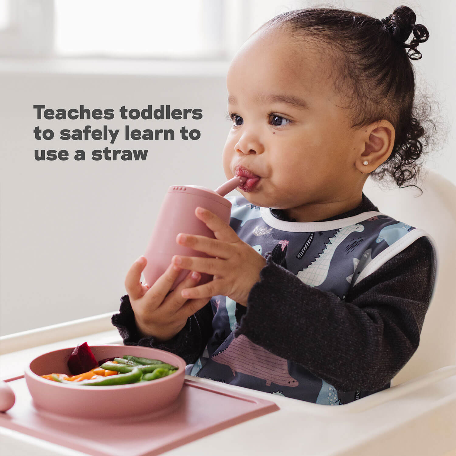 Mini Cup + Straw Training System by ezpz teaches toddlers to safely learn to use a straw