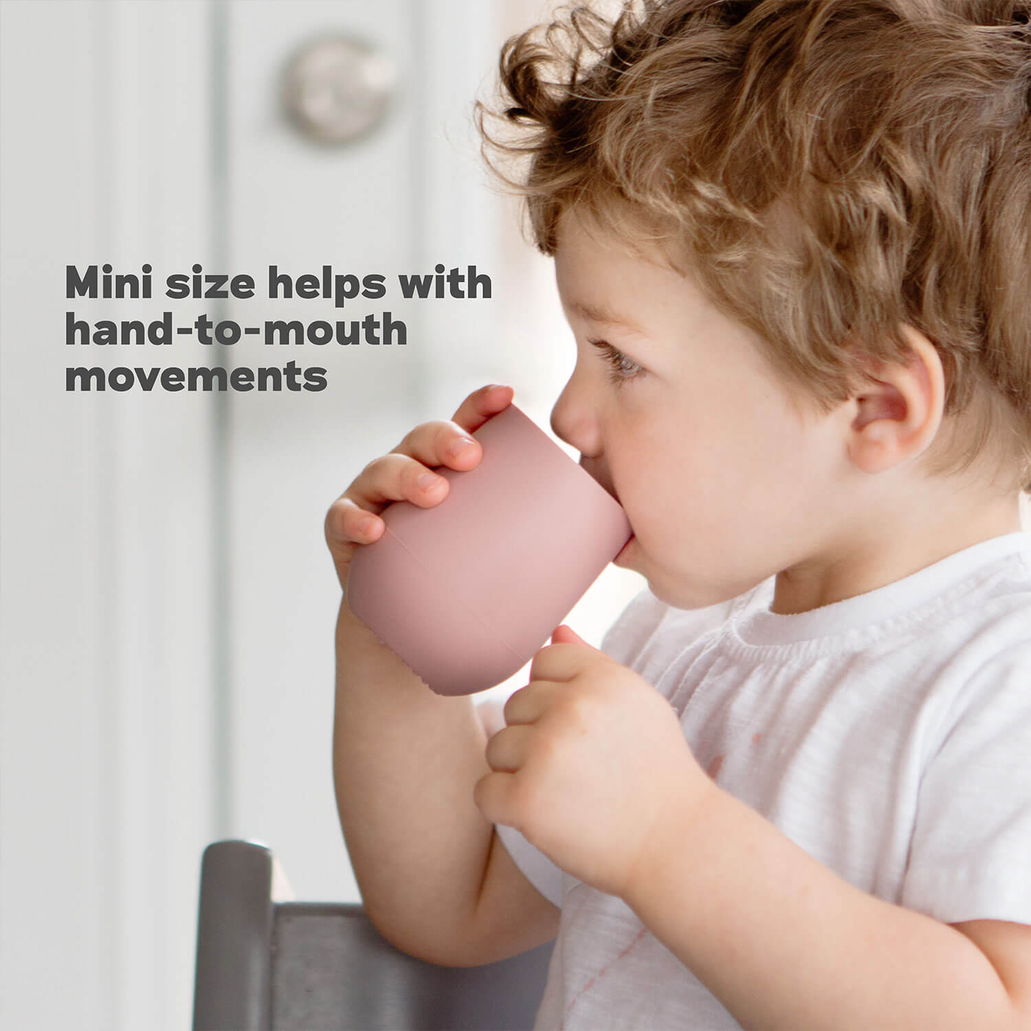 Mini Cup + Straw Training System by ezpz has a mini size that helps with hand-to-mouth movements