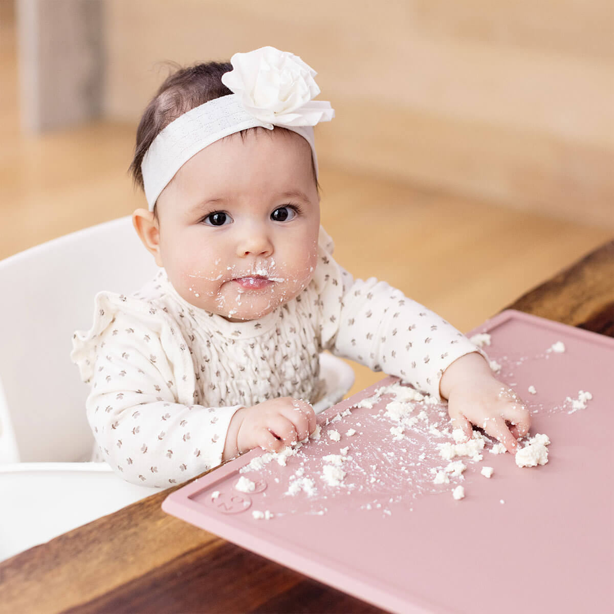 ezpz Mini Placemat in Blush Pink is a silicone placemat for toddlers that grips to the table