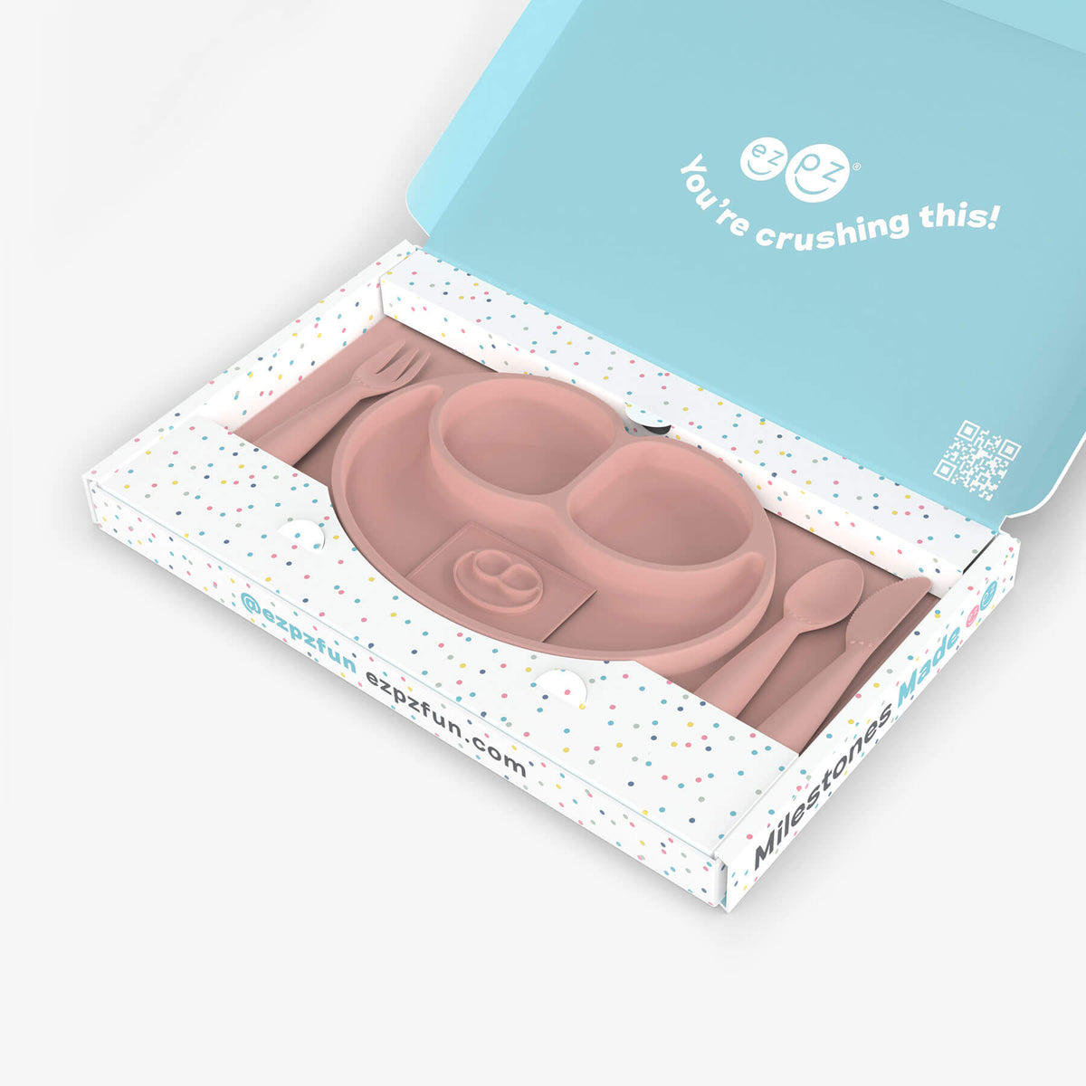 ezpz Kit 4 - Celebrate Mealtime Independence in Blush Pink includes the Happy Mat, Happy Utensils, and Micro Mat