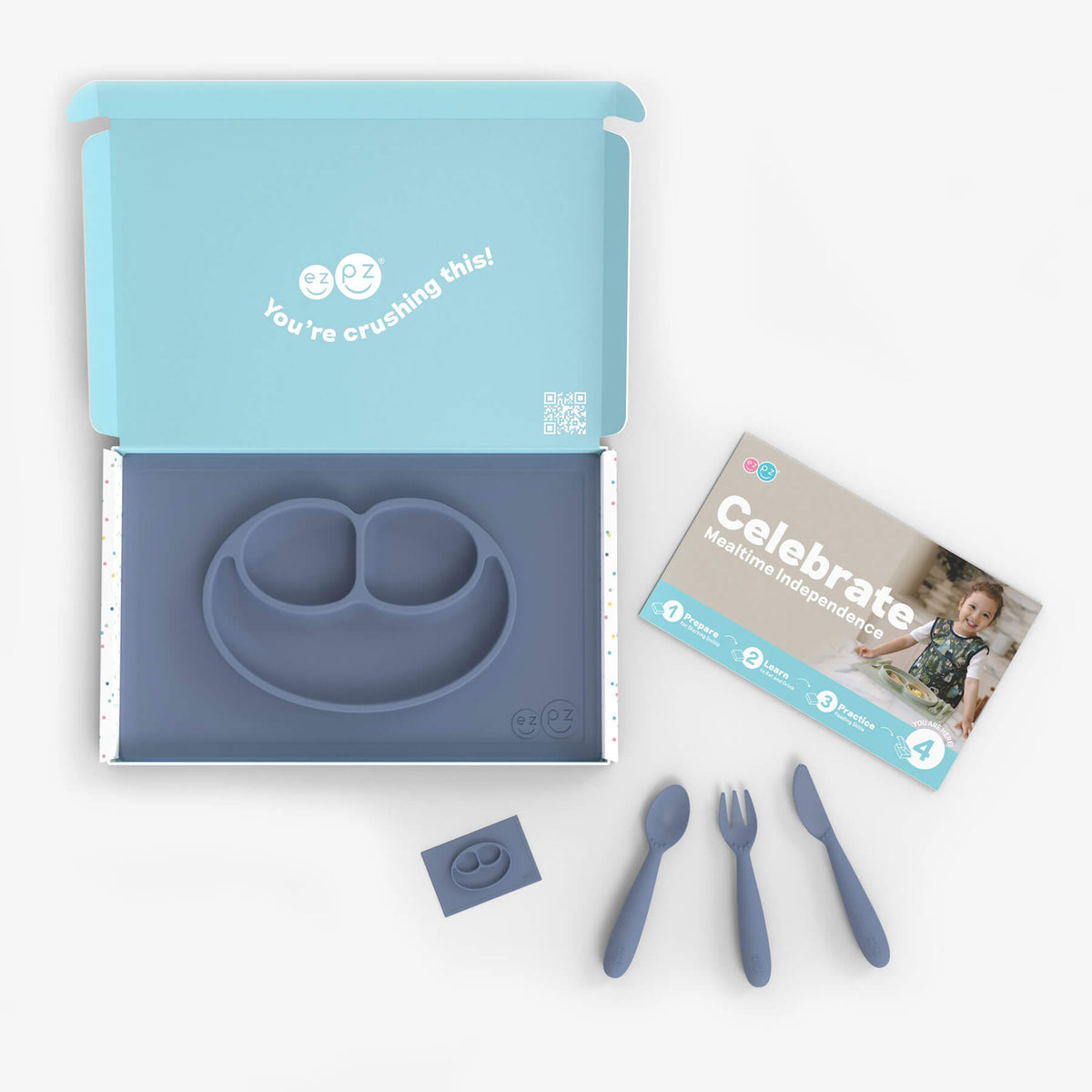 ezpz Kit 4 - Celebrate Mealtime Independence in Indigo Blue includes the Happy Mat, Happy Utensils, and Micro Mat #color_indigo