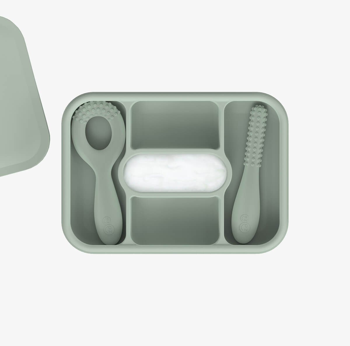 ezpz travel box in sage green is an all-in-one feeding + storage system that helps families pack, transport, and serve baby’s meals when away from home