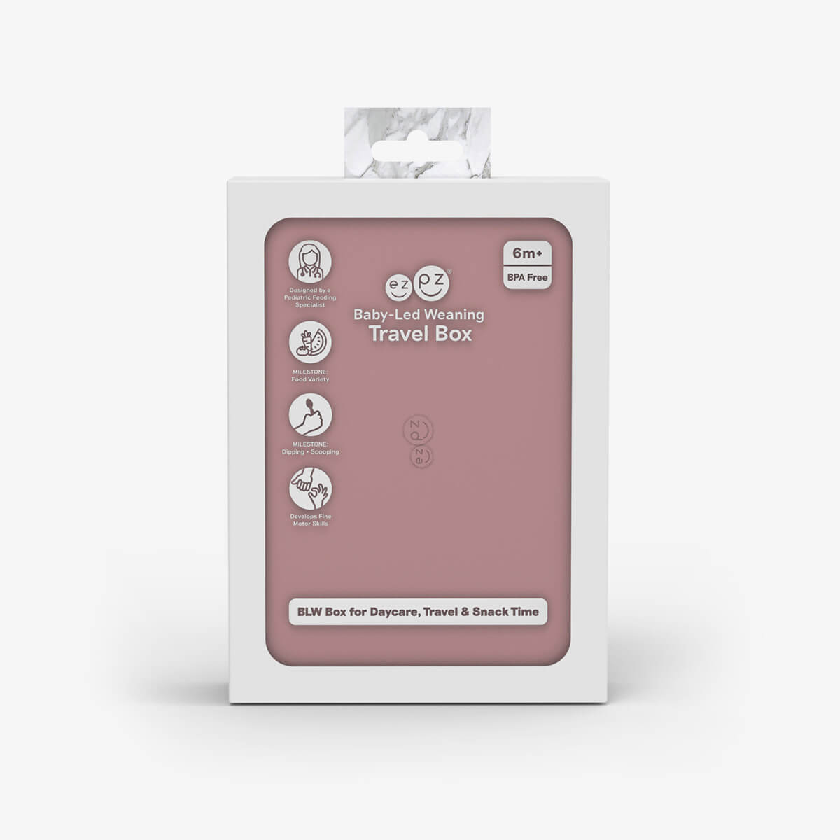 ezpz travel box in blush pink is an all-in-one feeding + storage system that helps families pack, transport, and serve baby’s meals when away from home