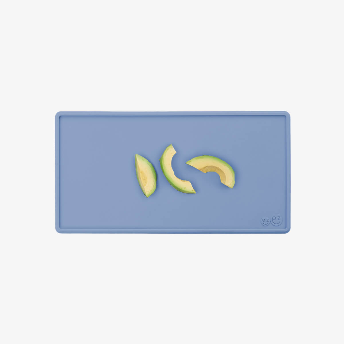 The Tiny Placemat in Indigo is a non-slip, silicone placemat that fits on most highchair trays