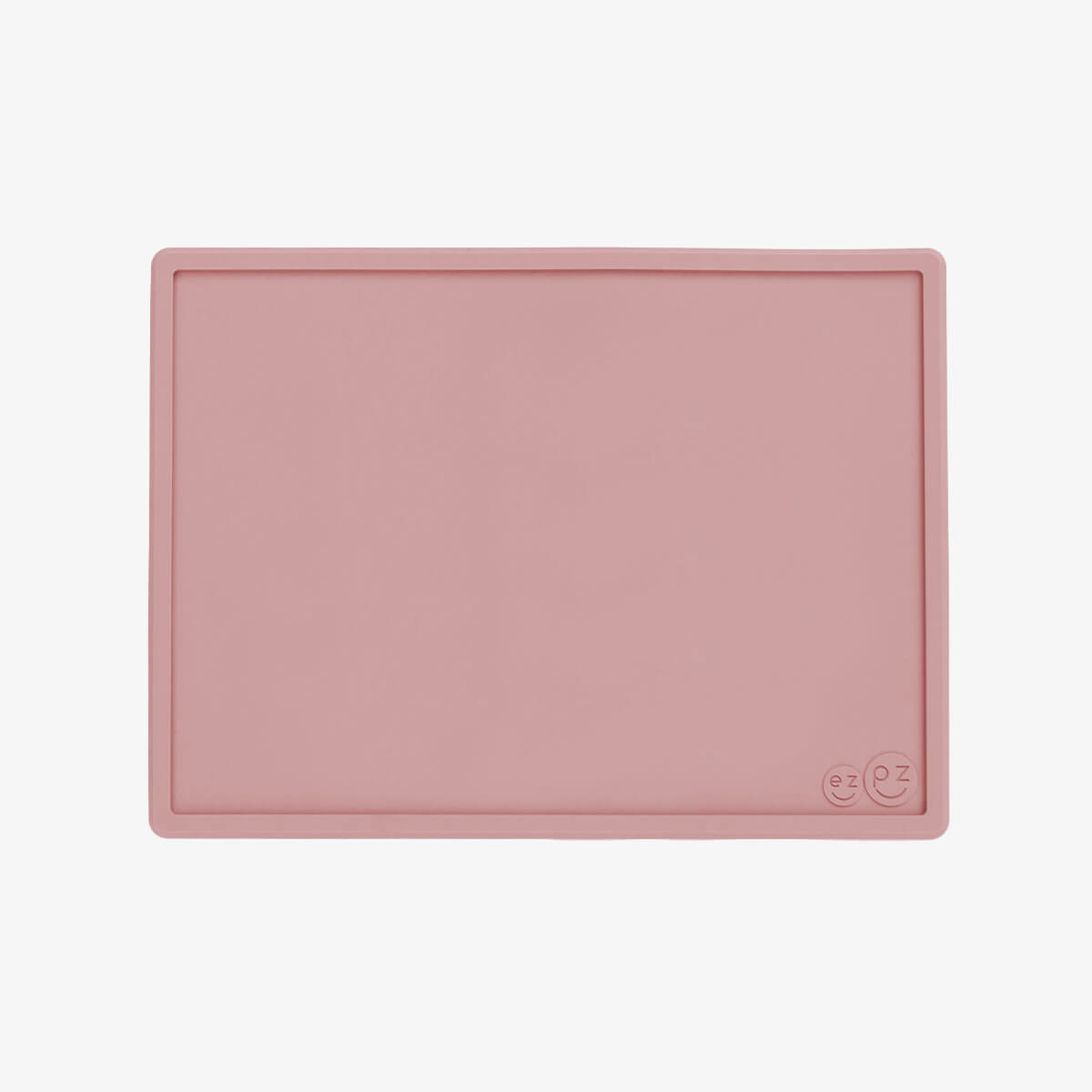 ezpz Mini Placemat in Blush Pink is a silicone placemat for toddlers that grips to the table