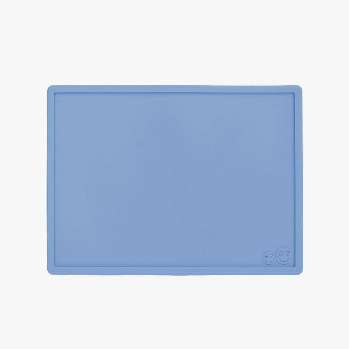 ezpz Mini Placemat in Indigo Blue is a silicone placemat for toddlers that grips to the table