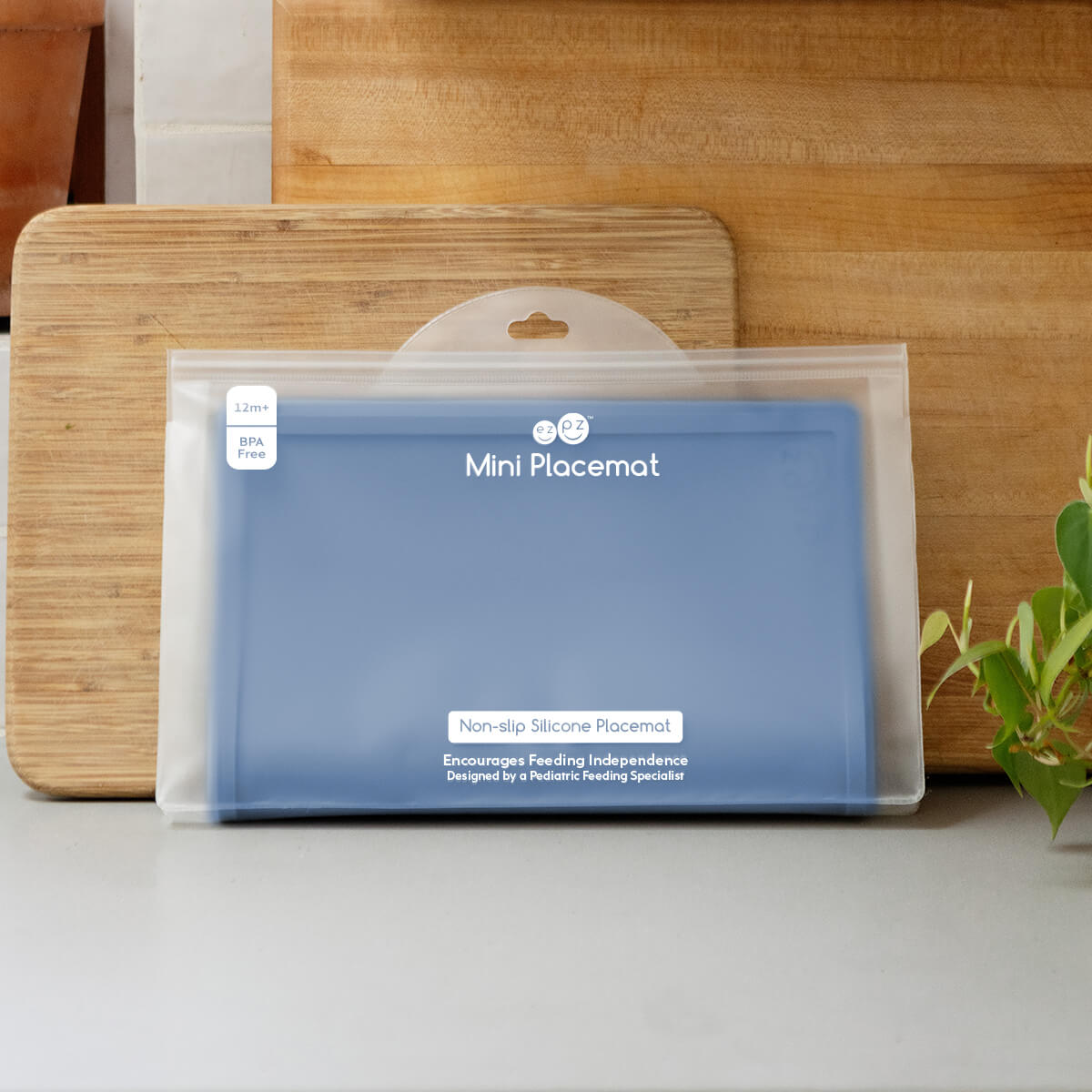 ezpz Mini Placemat in Indigo Blue is a silicone placemat for toddlers that grips to the table