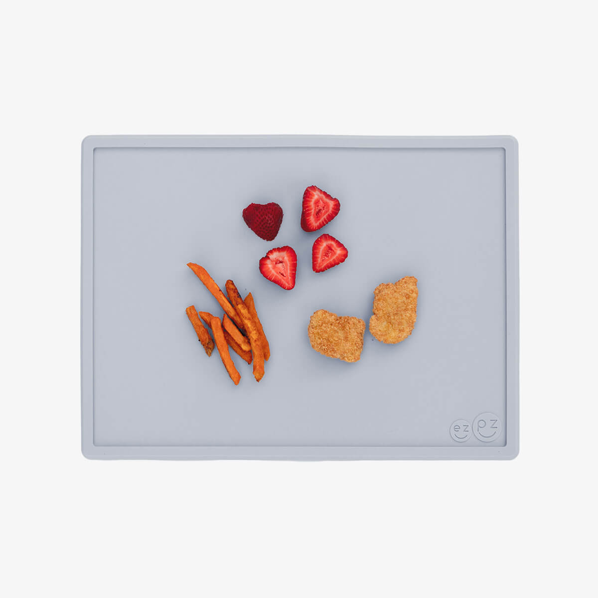 ezpz Mini Placemat in Pewter Gray is a silicone placemat for toddlers that grips to the table #color_pewter