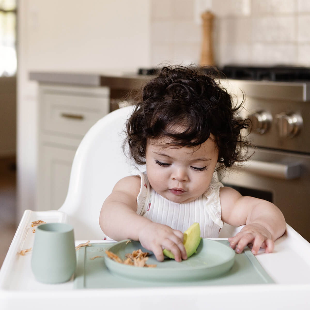 ezpz tiny plate in sage green / silicone plate for babies that suctions to the highchair