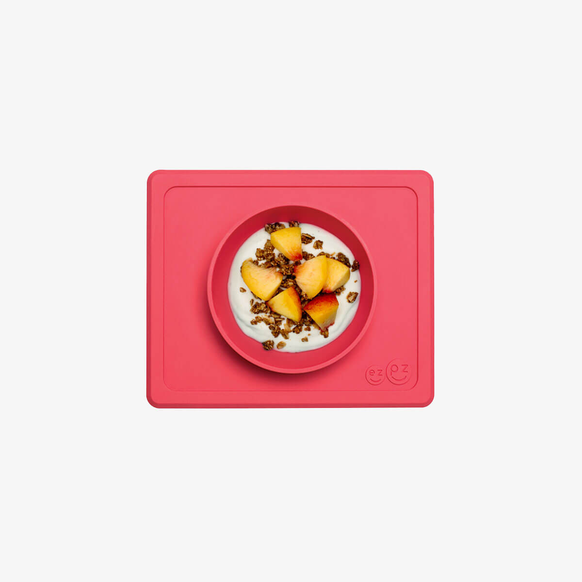 Mini Bowl in Coral by ezpz / The Original All-In-One Silicone Plates & Placemats that Stick to the Table