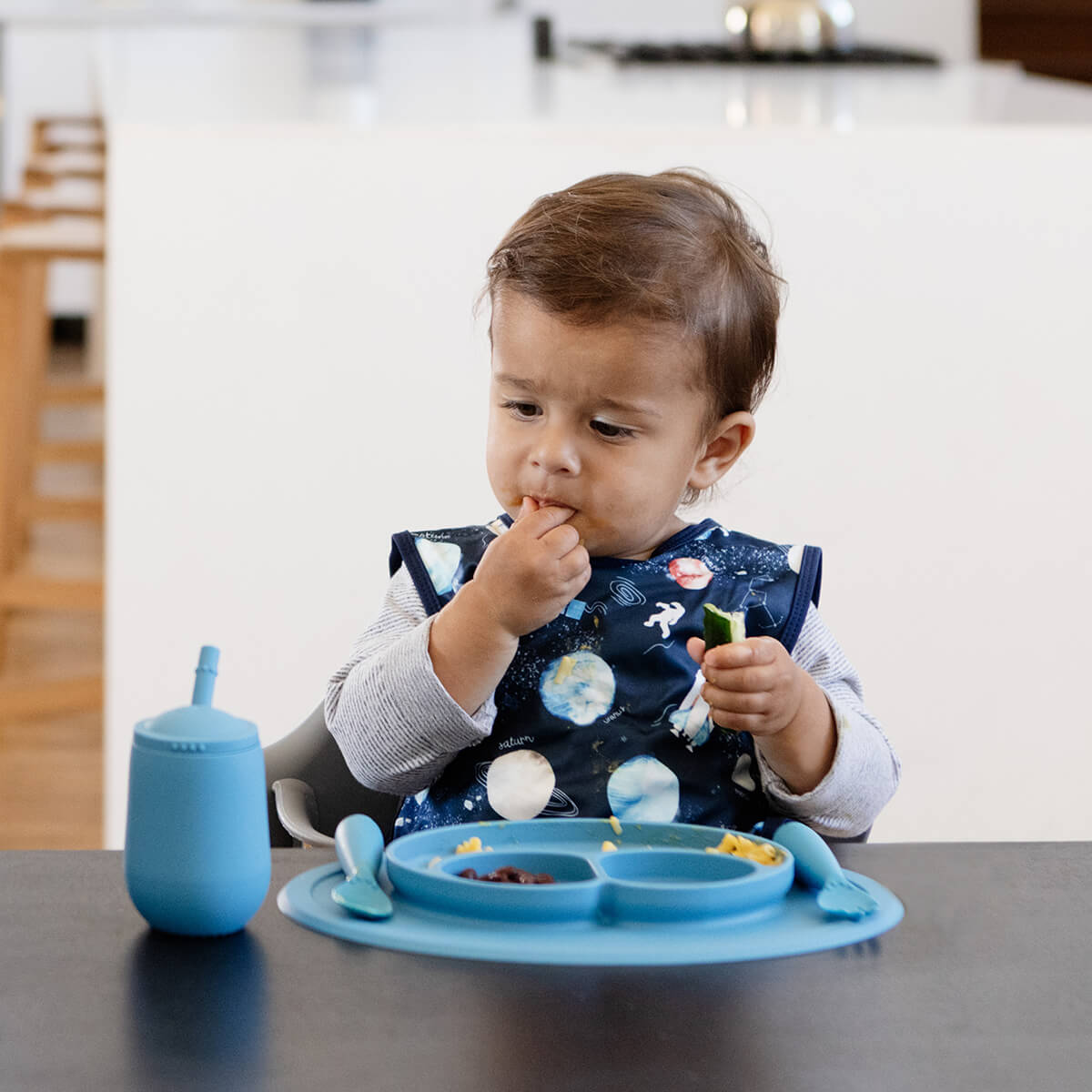 The Mini Cup + Straw in Blue by ezpz / Silicone Drinking Cup and Straw Training System for Toddlers