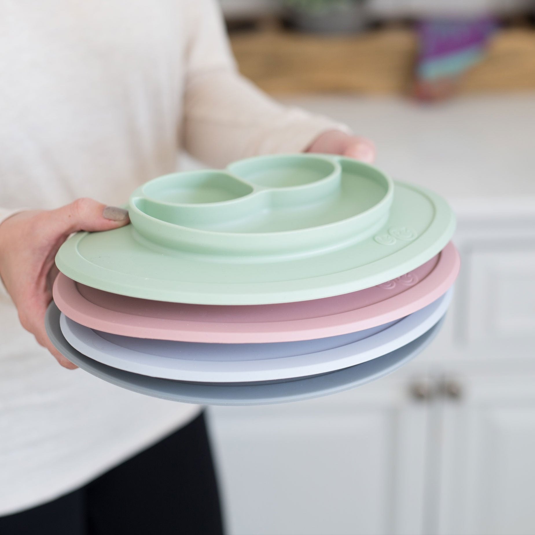 The Mini Mat by ezpz is a stackable Silicone Plate + Placemat with a suction feature that reduces the mess
