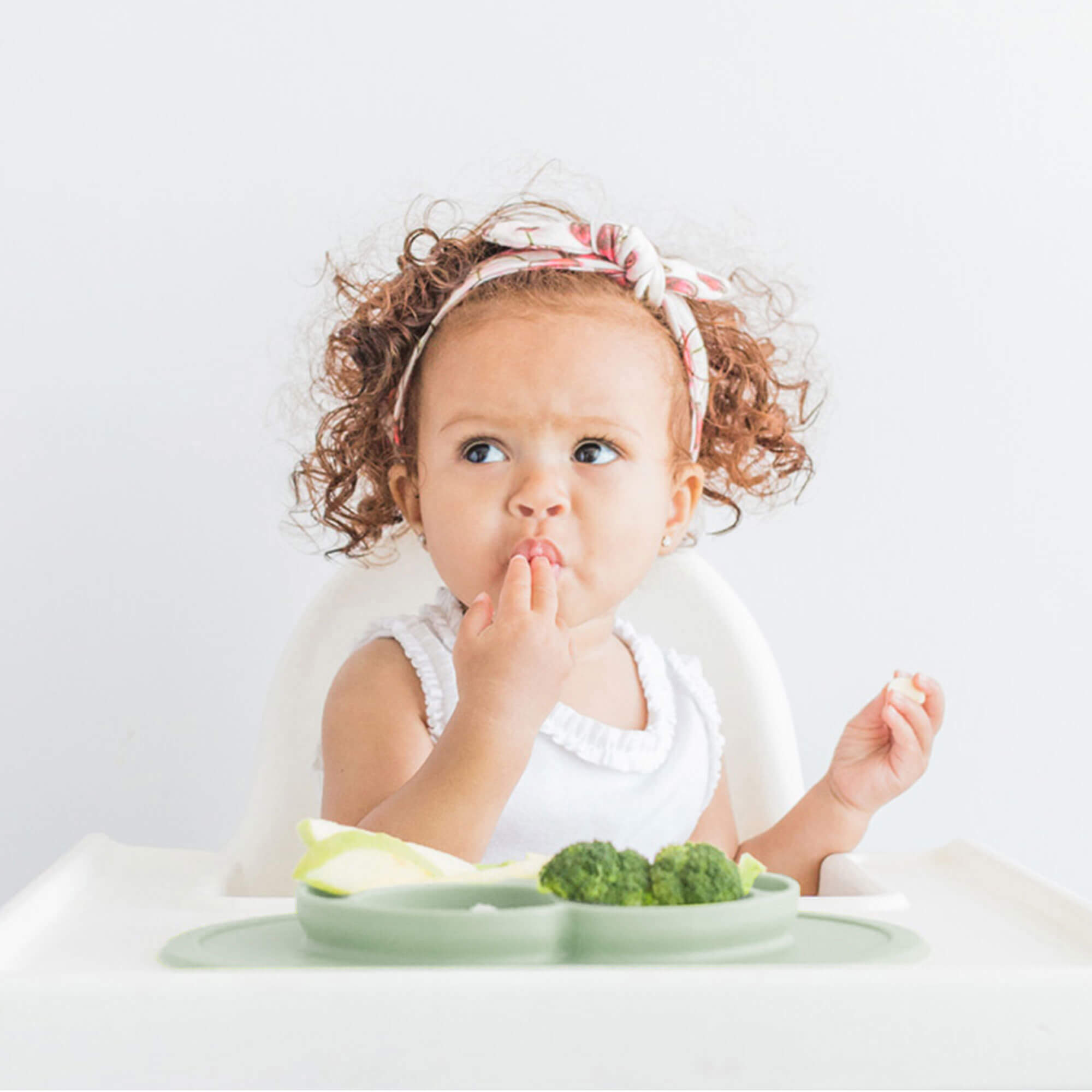 The Mini Mat in Sage Green by ezpz / Self-Suctioning Silicone Plate + Placemat #color_sage
