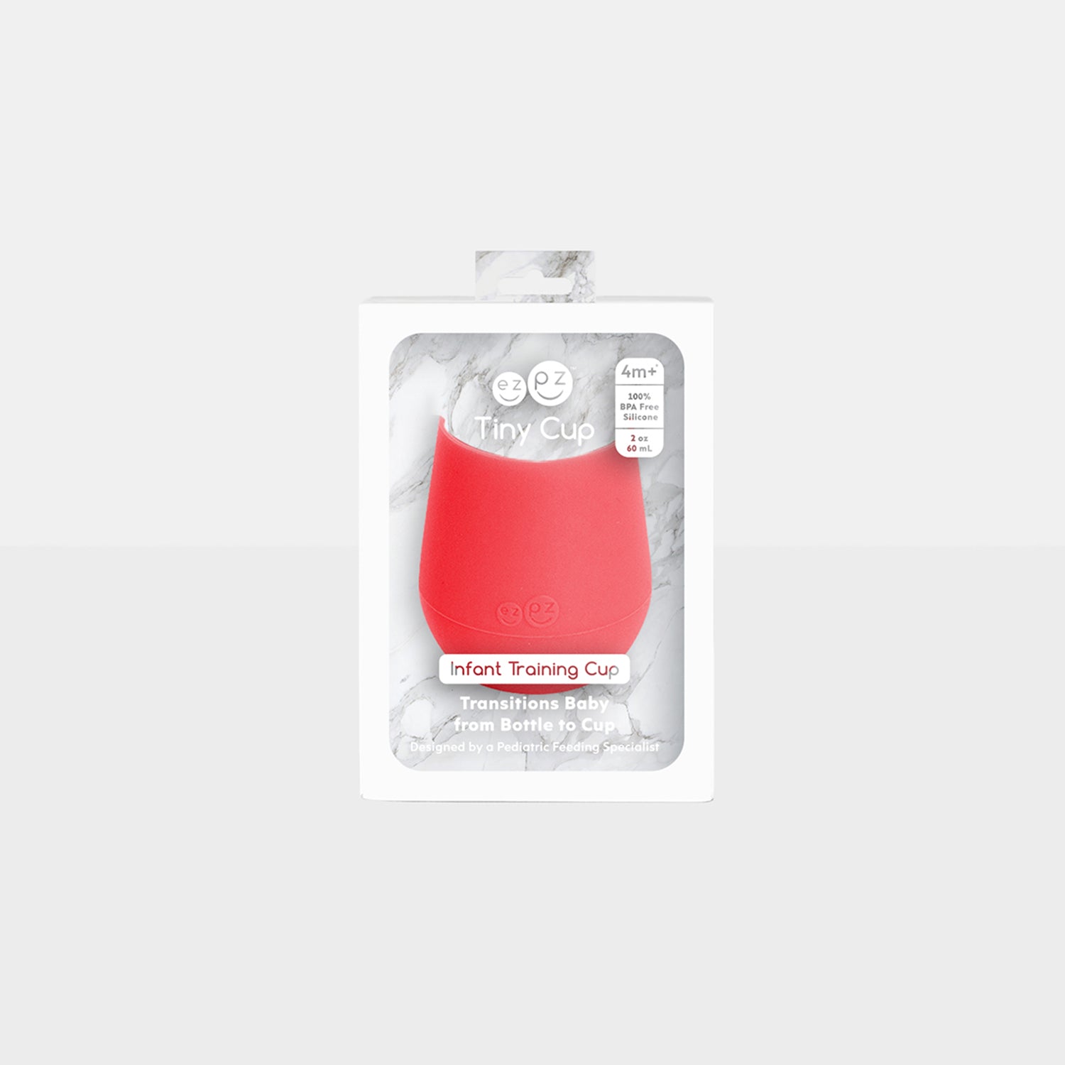 The Tiny Cup in Coral by ezpz / Open-Top, Silicone Drinking Cup for Babies