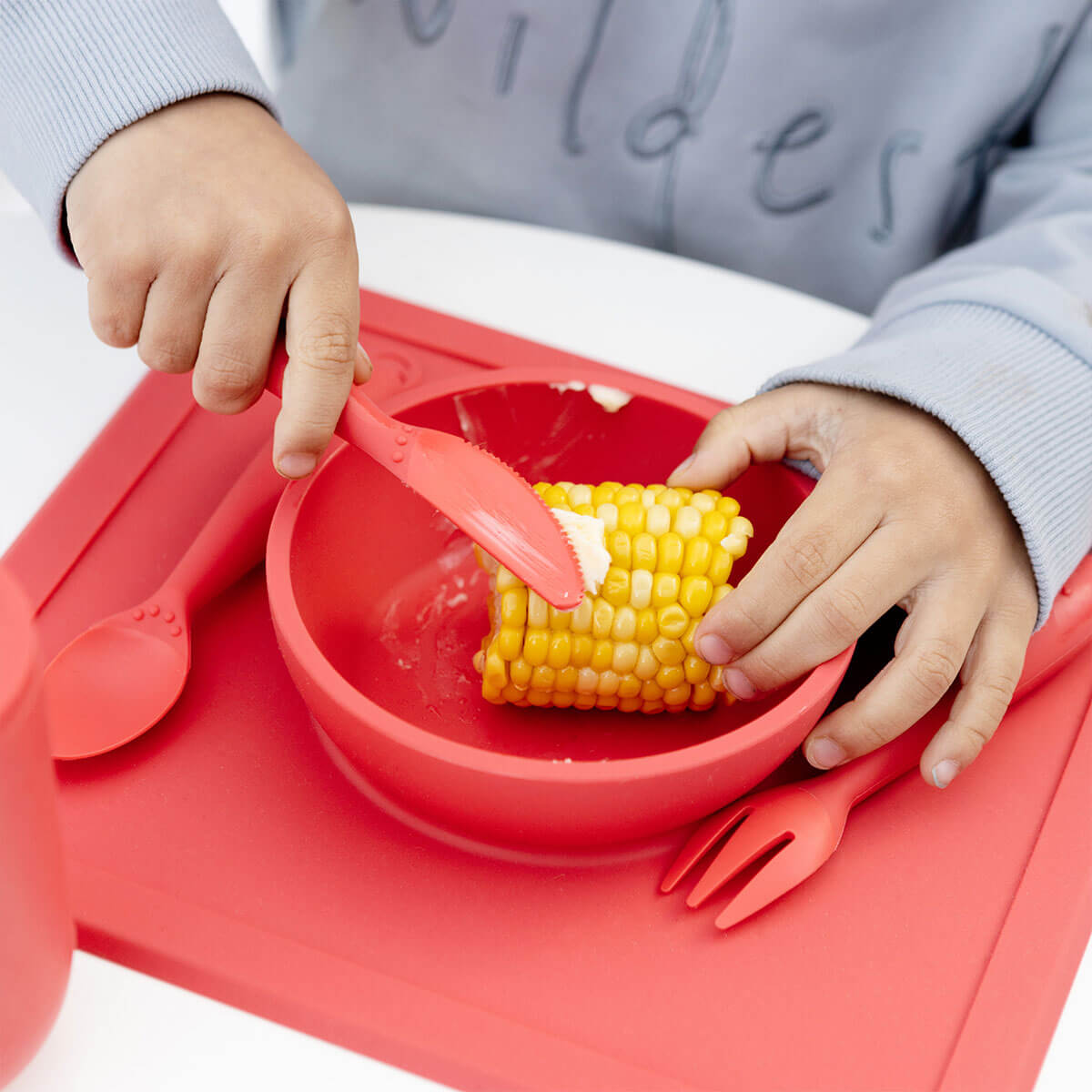 Happy Utensils in Coral by ezpz / Silicone Spoon, Fork and Knife Set for Kids