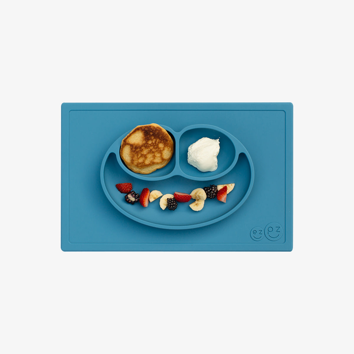 Happy Mat in Blue by ezpz / The Original All-In-One Silicone Plates & Placemats that Stick to the Table