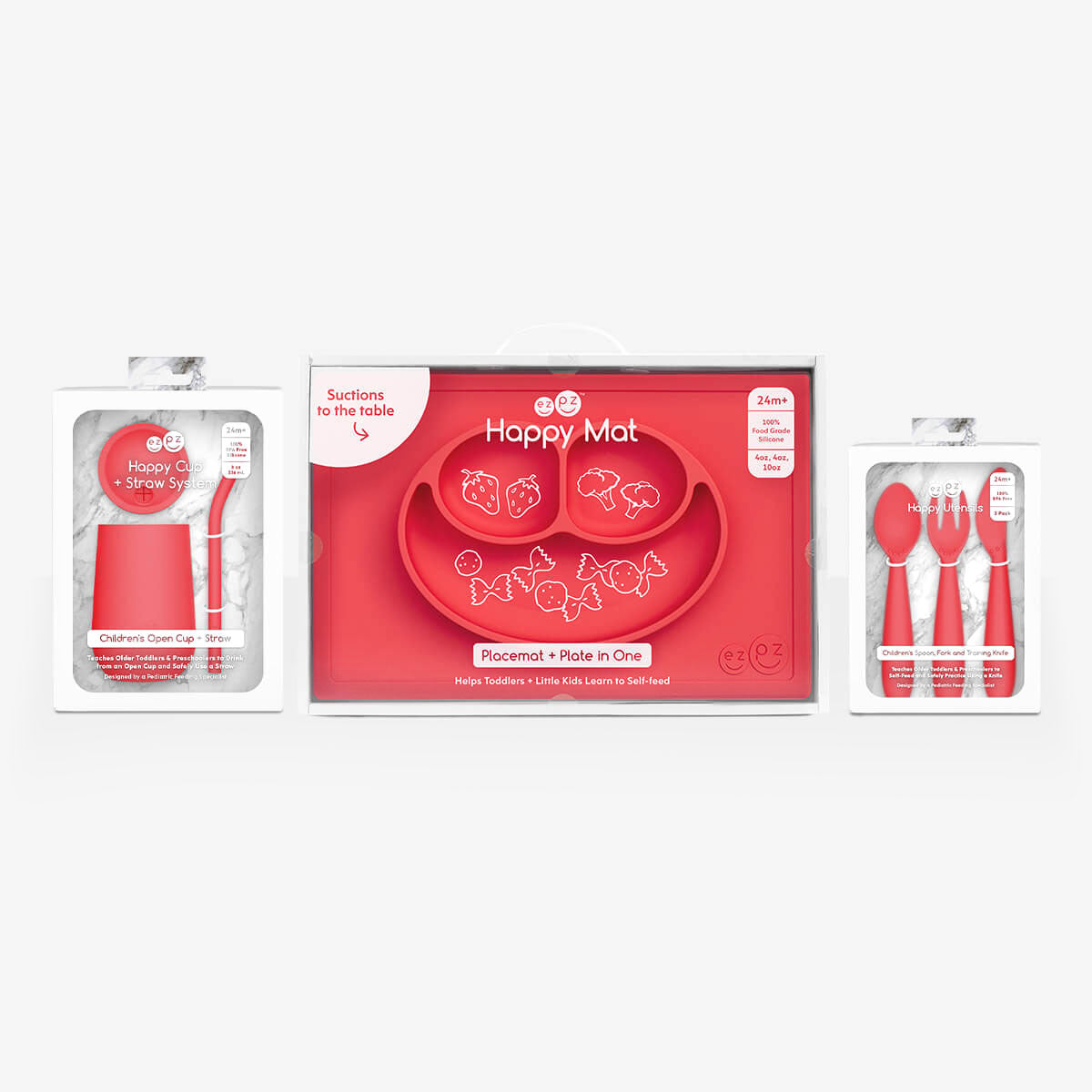 ezpz Happy Feeding Set in Coral / Silicone, Self-Suctioning Plate, Silicone Cup and Straw, Training Utensils for Toddlers