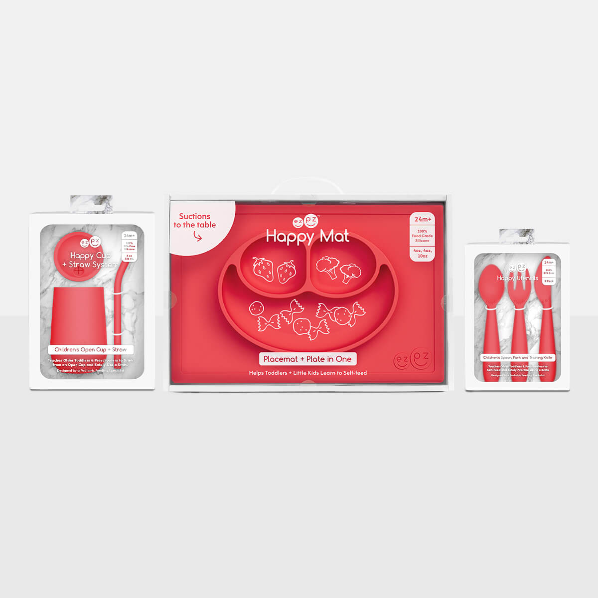 ezpz Happy Feeding Set in Coral / Silicone, Self-Suctioning Plate, Silicone Cup and Straw, Training Utensils for Toddlers