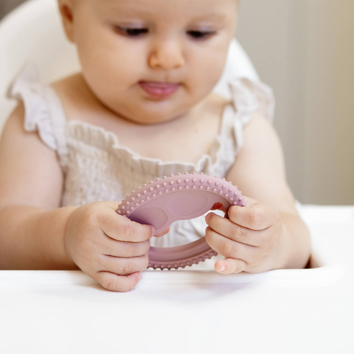 ezpz oral development tools in blush pink / silicone teethers for motor skill development