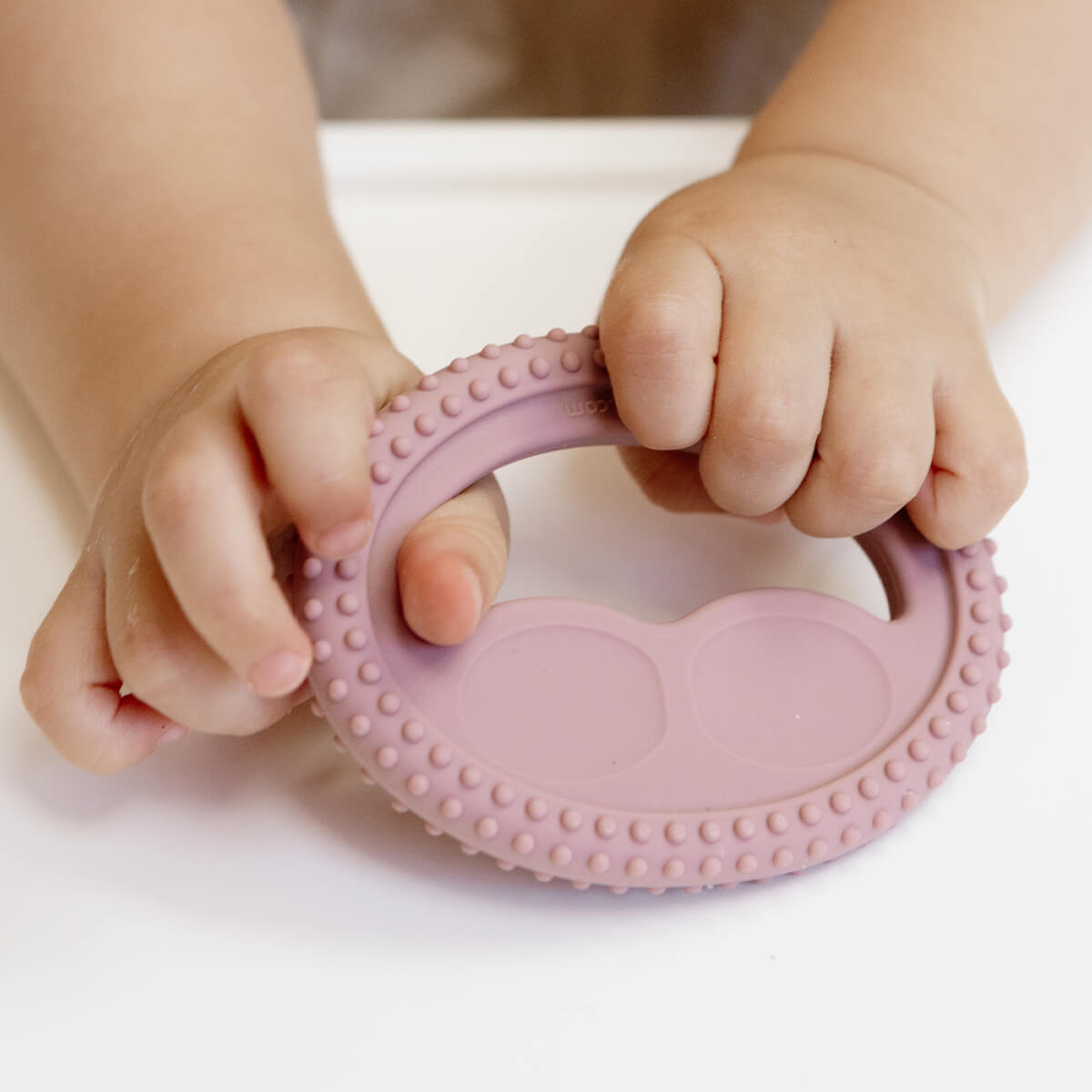 ezpz oral development tools in blush pink / silicone teethers for motor skill development