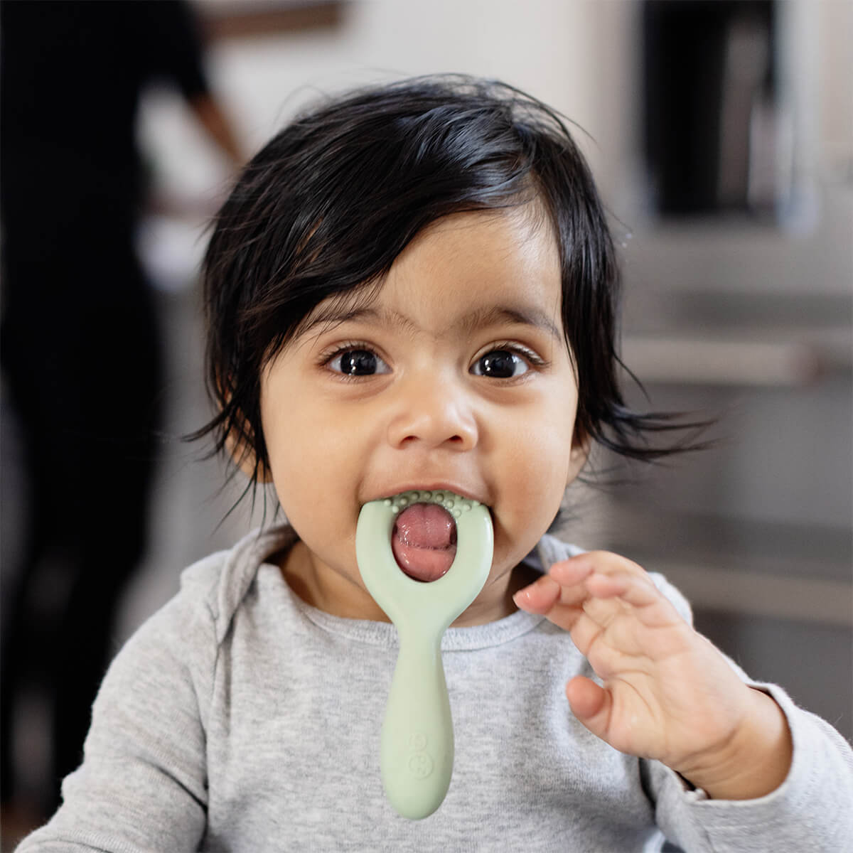 ezpz oral development tools in sage green / silicone teethers for motor skill development