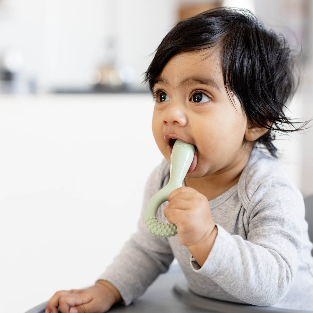 ezpz oral development tools in sage green / silicone teethers for motor skill development