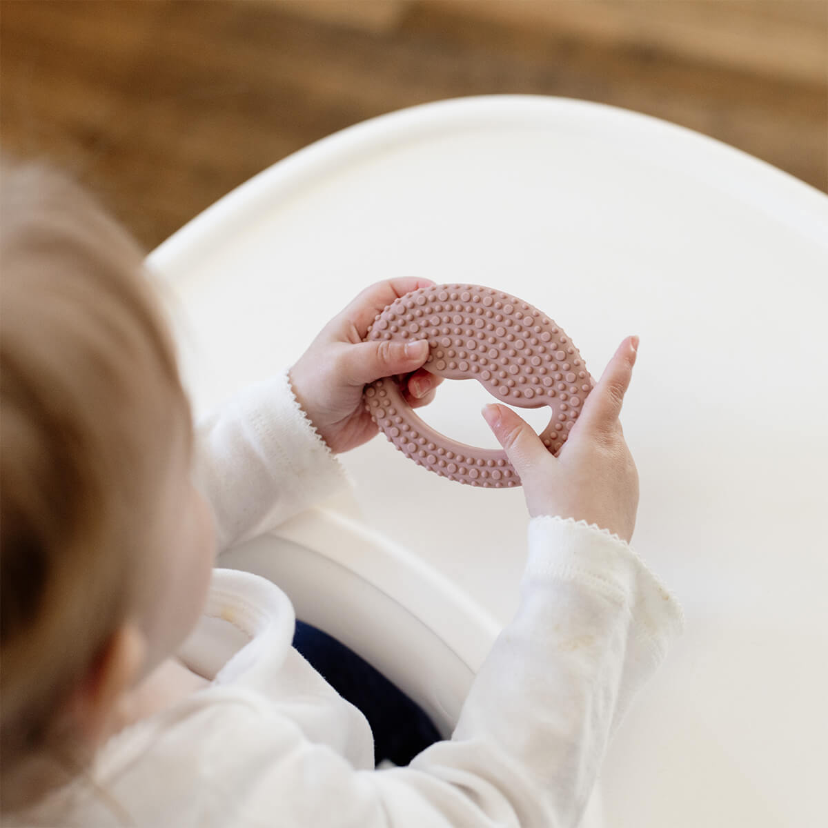 ezpz oral development tools in blush pink / silicone teethers for motor skill development