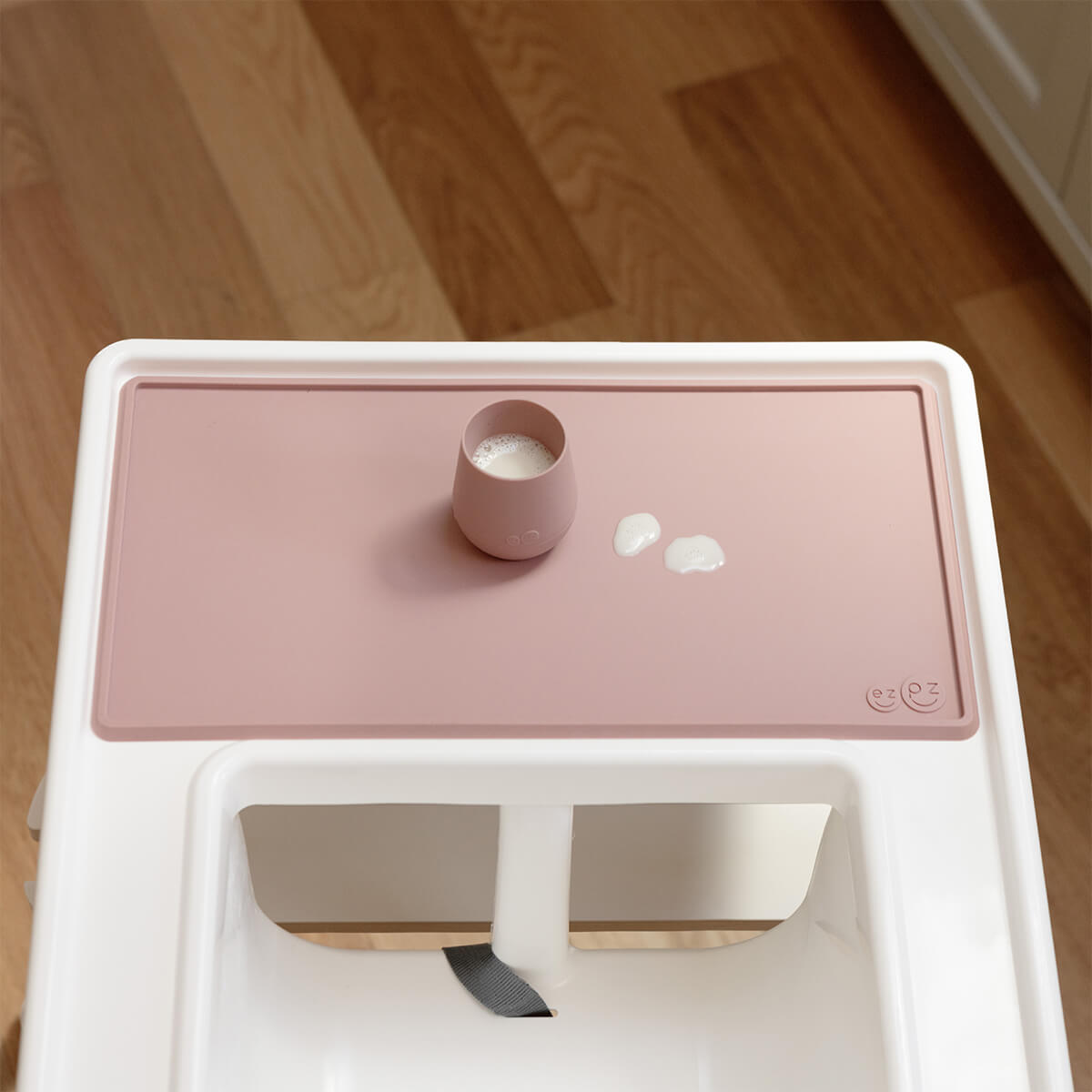 The Tiny Placemat in Blush is a non-slip, silicone placemat that fits on most highchair trays