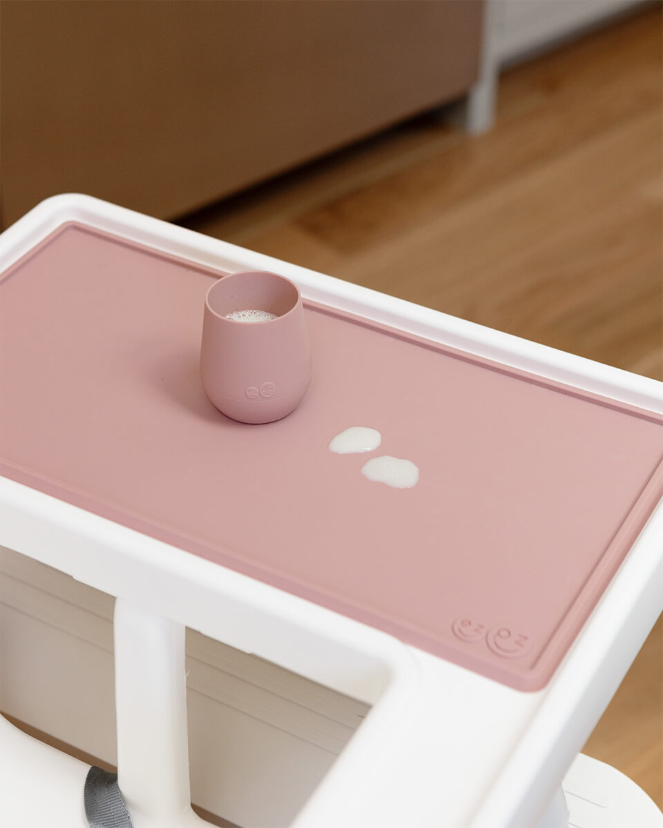 The Tiny Placemat in Blush is a non-slip, silicone placemat that fits on most highchair trays