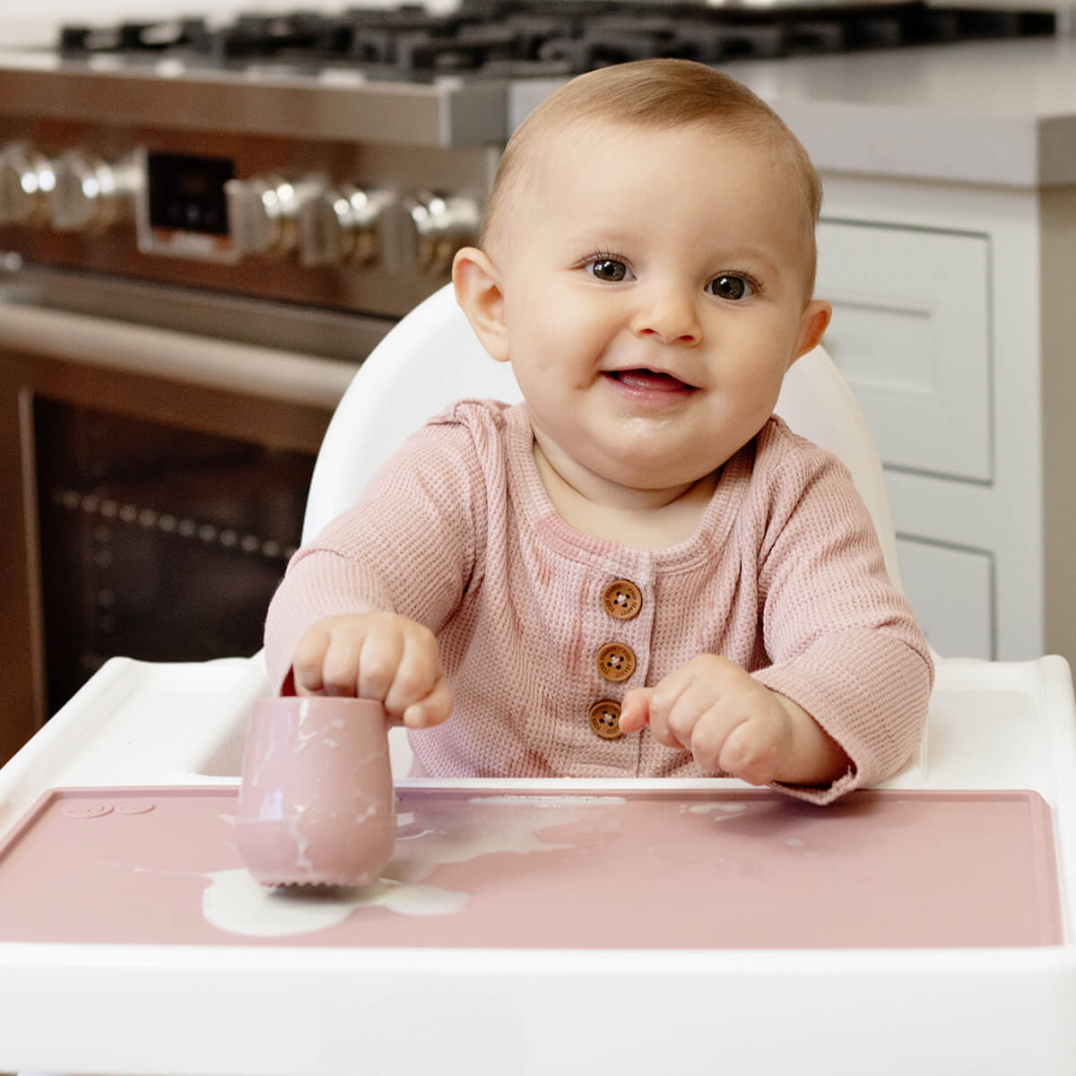 The Tiny Placemat in Blush is a non-slip, silicone placemat that fits on most highchair trays