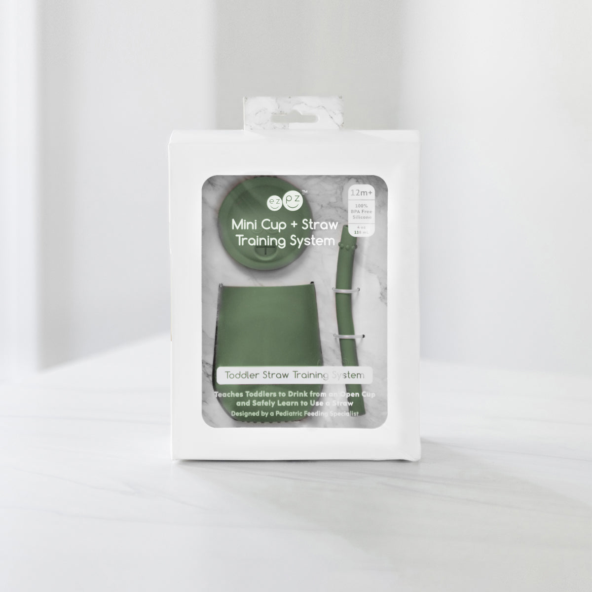 The Mini Cup + Straw in Olive by ezpz / Silicone Drinking Cup and Straw Training System for Toddlers