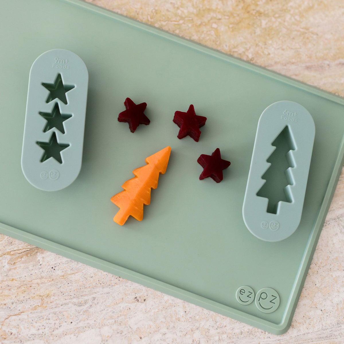 ezpz Baby-Led Weaning Festive Food Cutters to cut baby food into star and tree shapes Christmas-themed