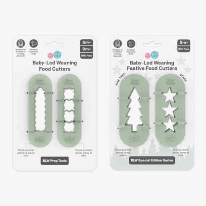 ezpz Baby-Led Weaning Festive Food Cutters to cut baby food into star and tree shapes Christmas-themed 