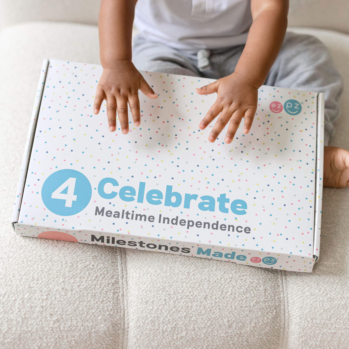 ezpz Kit 4 - Celebrate Mealtime Independence includes the Happy Mat, Happy Utensils, and Micro Mat
