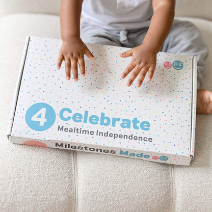 ezpz Kit 4 - Celebrate Mealtime Independence includes the Happy Mat, Happy Utensils, and Micro Mat