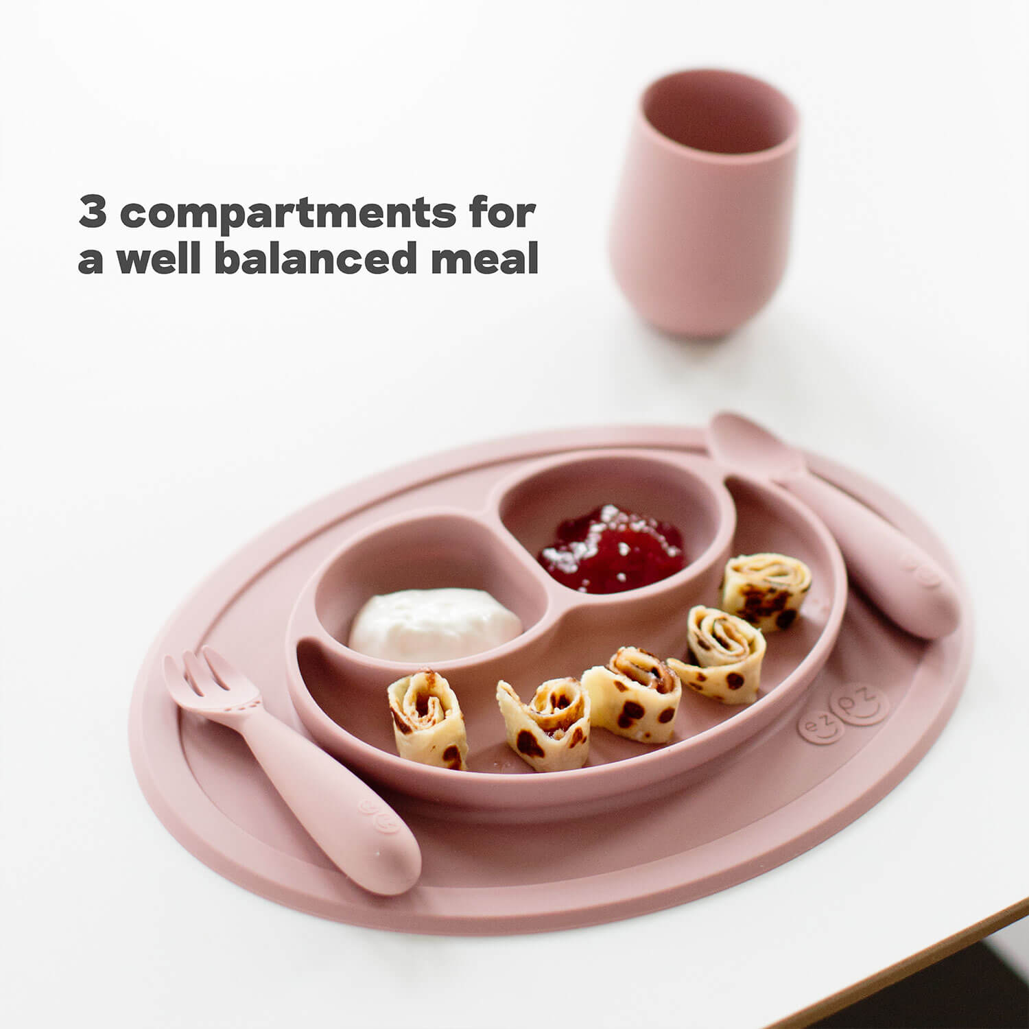 The Mini Mat by ezpz is a Silicone Plate + Placemat with 3 compartments for a well balanced meal