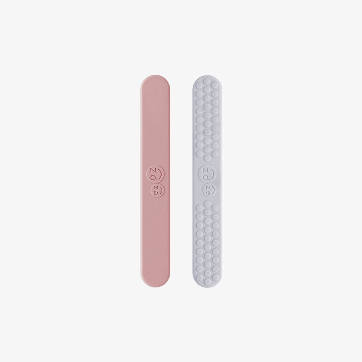 ezpz sensory tongue depressor in blush pink and pewter gray / silicone tongue depressor for babies