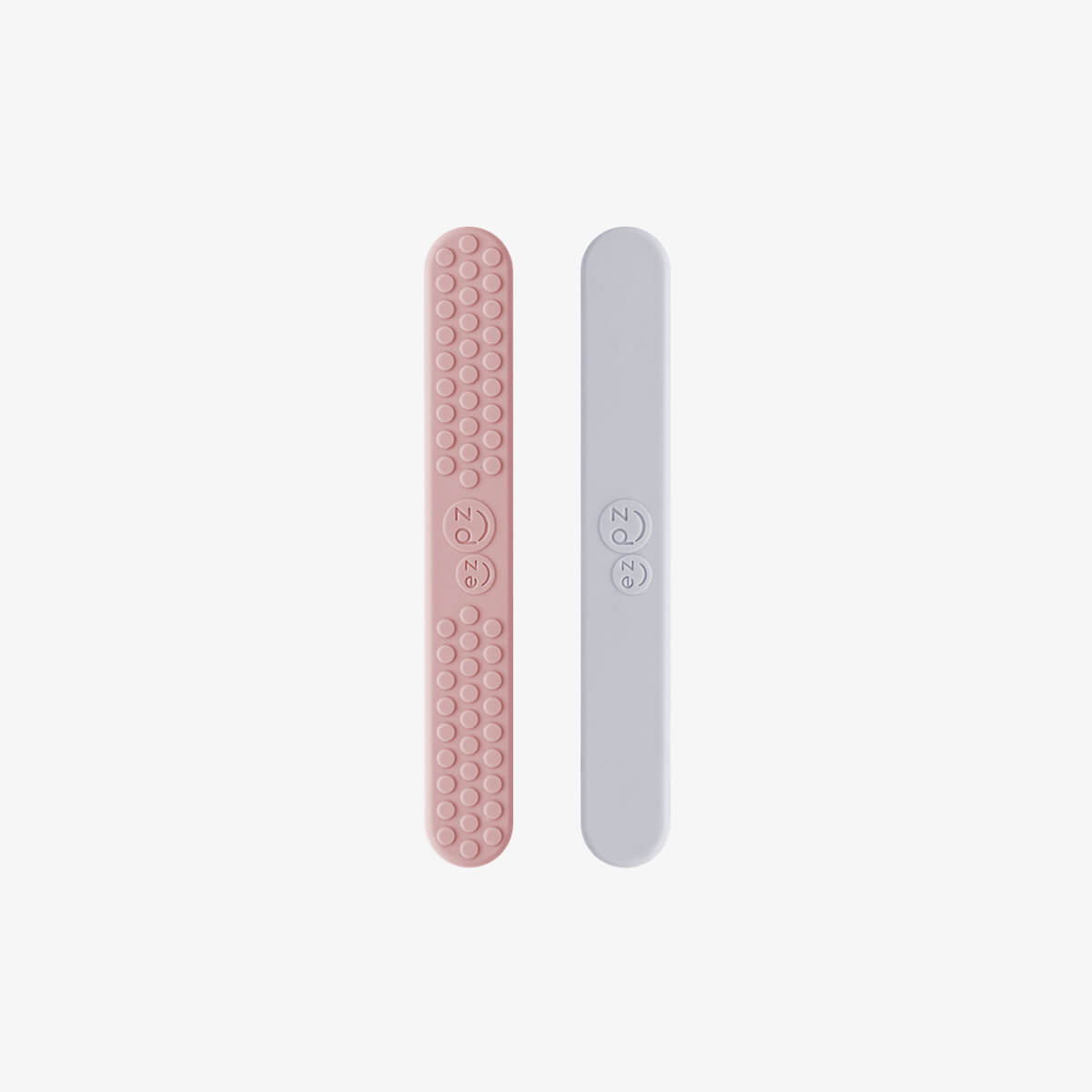 ezpz sensory tongue depressor in blush pink and pewter gray / silicone tongue depressor for babies