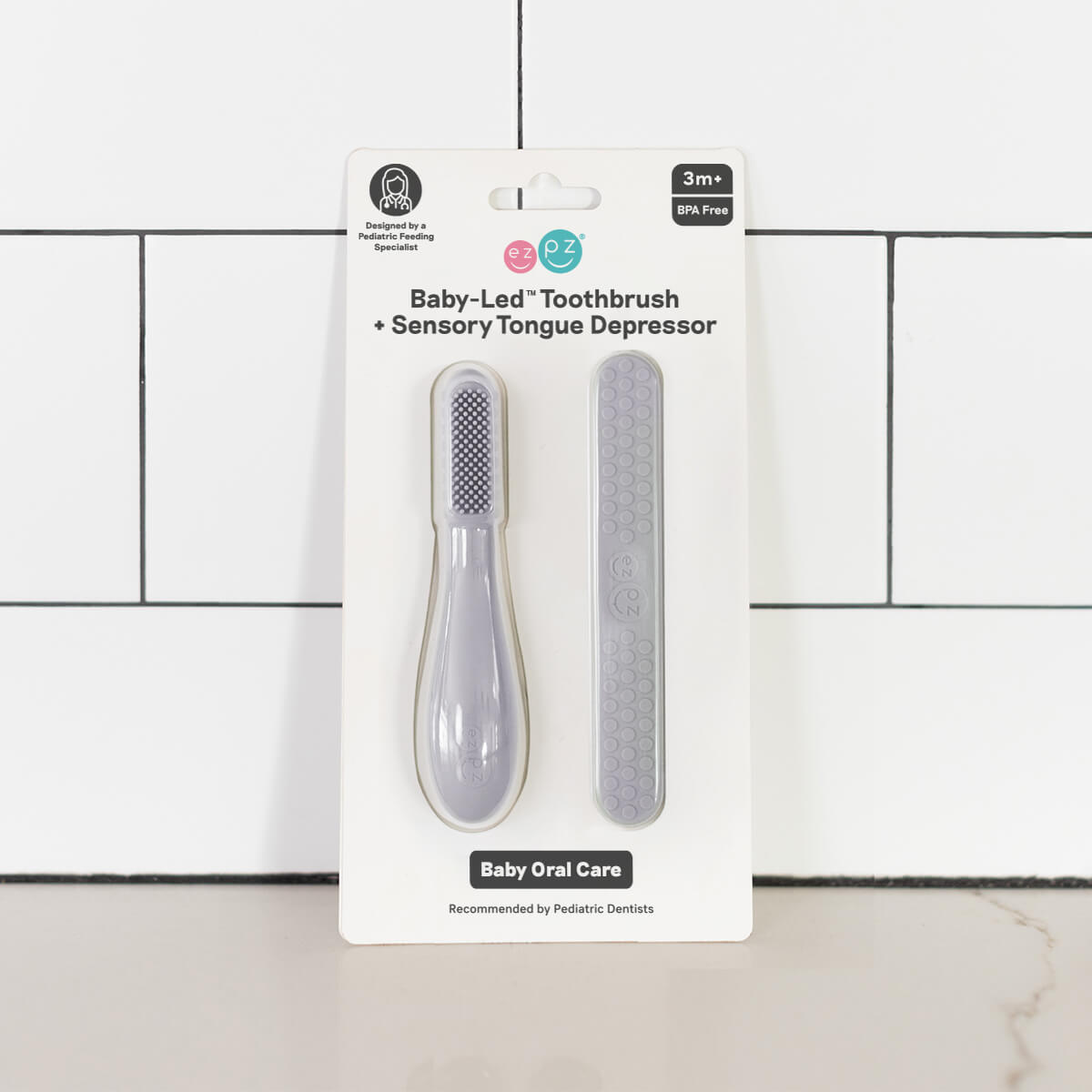 ezpz baby led toothbrush and sensory tongue depressor in pewter gray