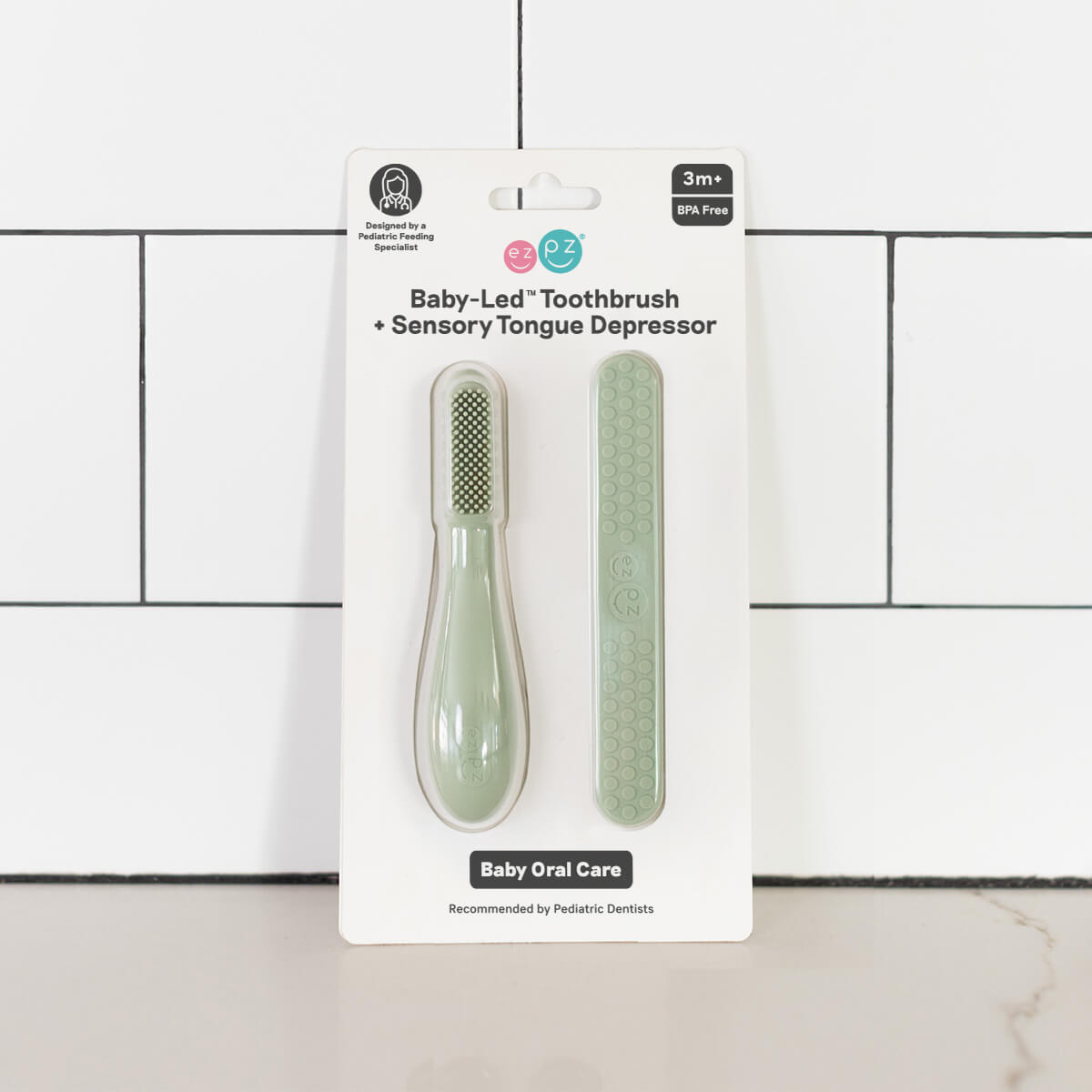 ezpz baby led toothbrush and sensory tongue depressor in sage green