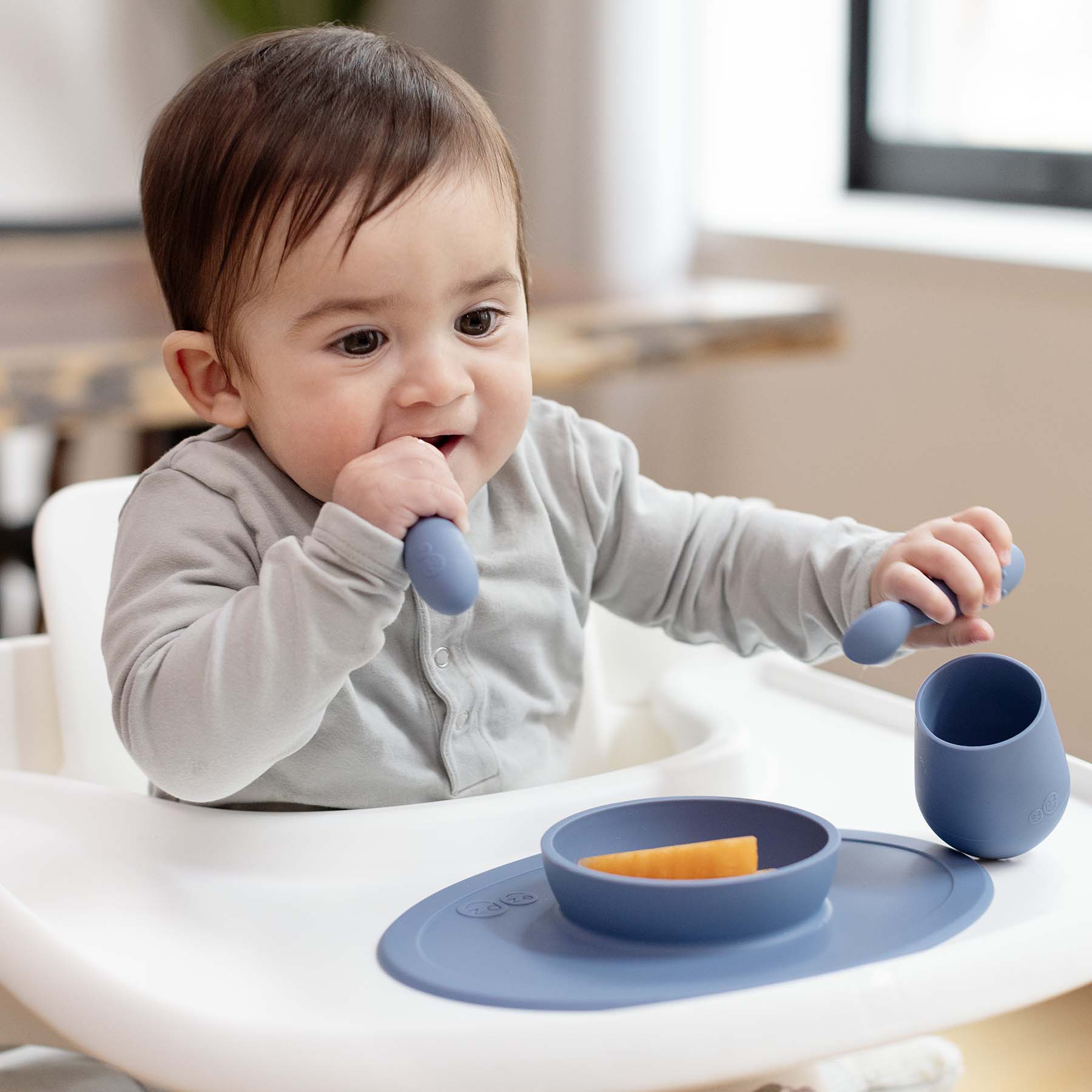 ezpz First Foods Set includes a silicone bowl, cup, and spoons for baby-led weaning and eating skill development for babies