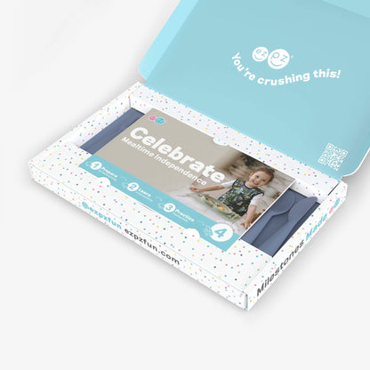 ezpz Kit 4 - Celebrate Mealtime Independence in Indigo Blue includes the Happy Mat, Happy Utensils, and Micro Mat 