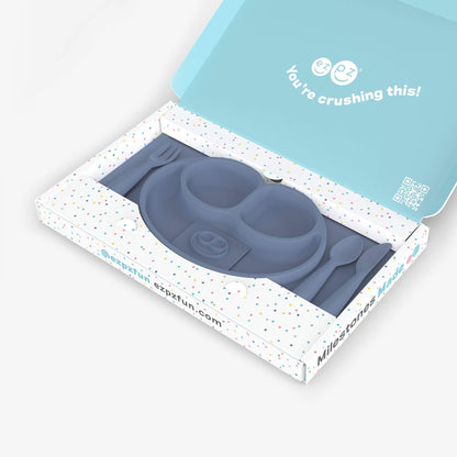 ezpz Kit 4 - Celebrate Mealtime Independence in Indigo Blue includes the Happy Mat, Happy Utensils, and Micro Mat 