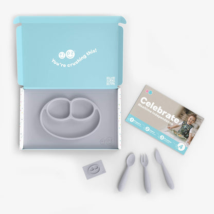 ezpz Kit 4 - Celebrate Mealtime Independence in Pewter Gray includes the Happy Mat, Happy Utensils, and Micro Mat 