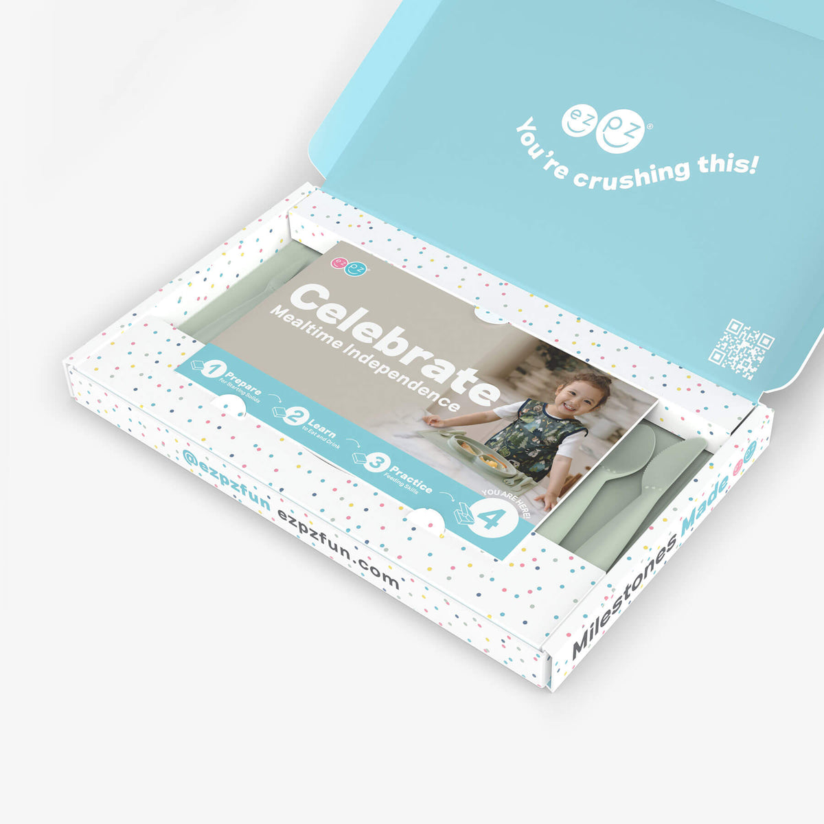 ezpz Kit 4 - Celebrate Mealtime Independence in Sage Green includes the Happy Mat, Happy Utensils, and Micro Mat 