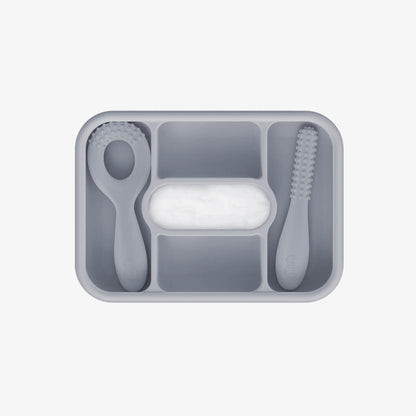 ezpz travel box in pewter gray is an all-in-one feeding + storage system that helps families pack, transport, and serve baby’s meals when away from home 