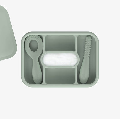 ezpz travel box in sage green is an all-in-one feeding + storage system that helps families pack, transport, and serve baby’s meals when away from home 