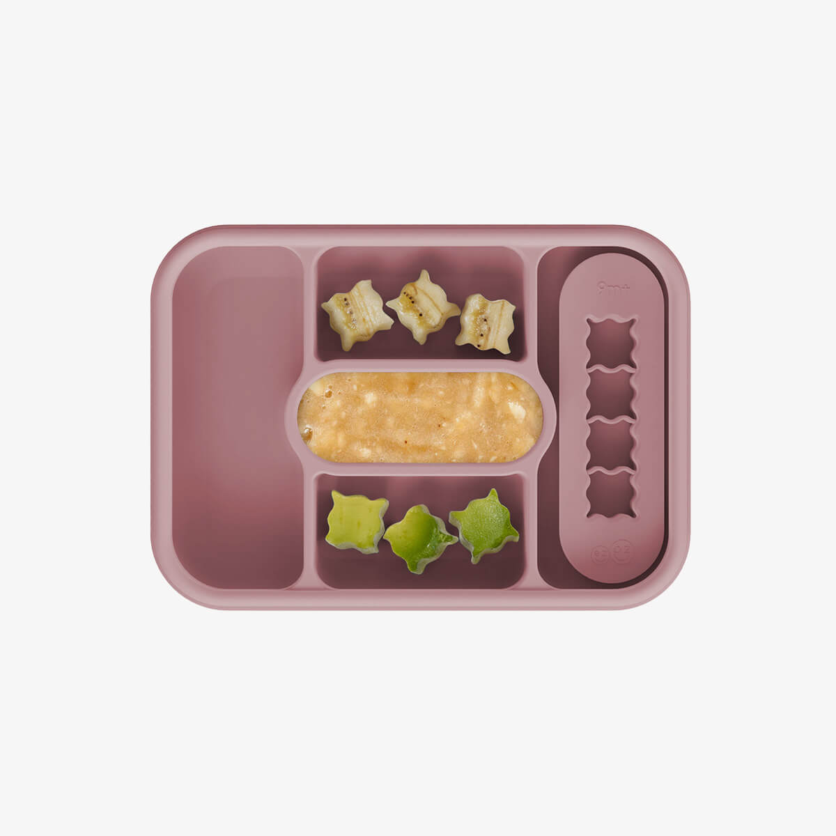 ezpz travel box in blush pink is an all-in-one feeding + storage system that helps families pack, transport, and serve baby’s meals when away from home 